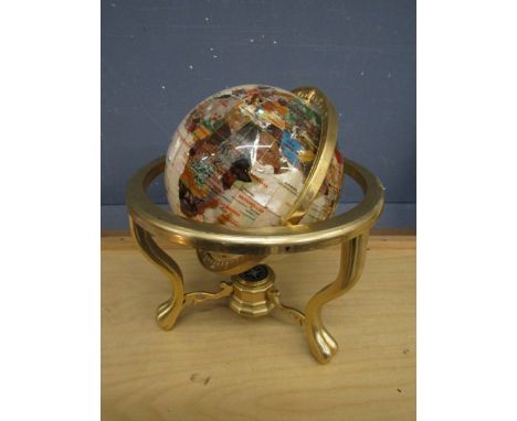 A semi precious stone nautical globe in brass stand. Damaged