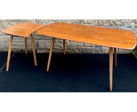 An Ercol Windsor plank top dining table, in light elm, with a single ‘crescent-top’ extender table section, the table measuri