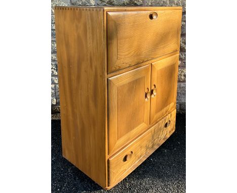 An Ercol Windsor light elm serving cabinet, 109cm high x 83cm wide x 46cm deep.