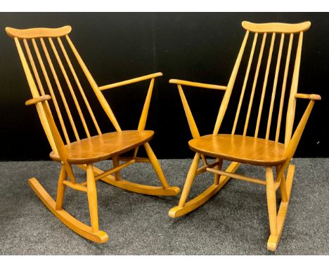 A pair of Ercol Goldsmiths model elm and beech rocking chairs, in light elm, 86cm high (38cm to seat) x 63cm wide x 71cm deep