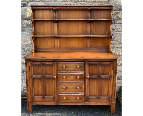 An Ercol Old Colonial elm dresser, 170cm high x 146.5cm wide x 52cm deep.