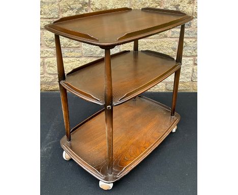 An Ercol Windsor dark elm three-tier trolley, 77cm high x 72cm wide x 46cm deep.