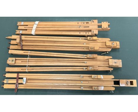 Artist’s equipment - a Daler Rowney beechwood floor-standing tripod easel;  three others similar, (4).