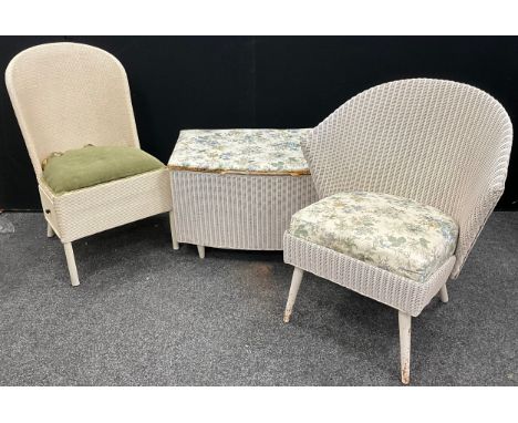 A contemporary wicker blanket chest; a Lloyd Loom style wicker wingback chair; another, (3).