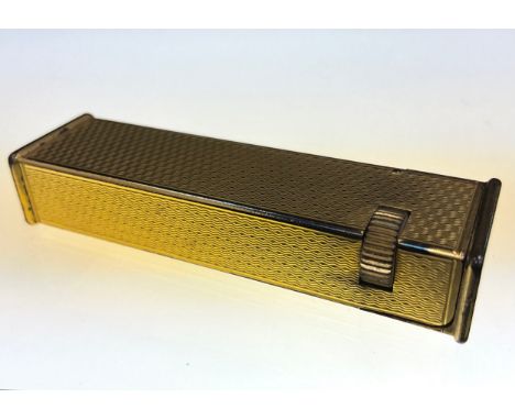 A vintage Dunhill Cartier Licence Tallboy pocket lighter, slender textured body, impressed marks, 6.4cm long