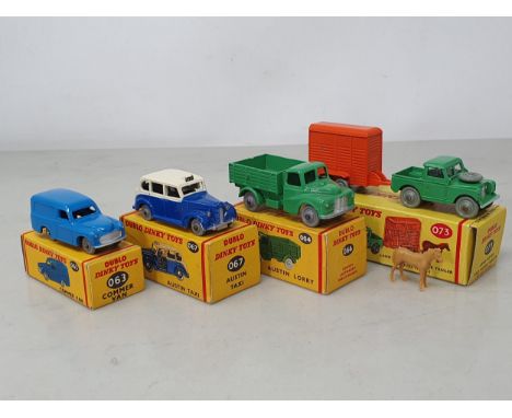 Four boxed Dublo Dinky Toys including 063 Commer Van, 064 Austin Lorry, 067 Austin Taxi and 073 Land Rover and Trailer with c