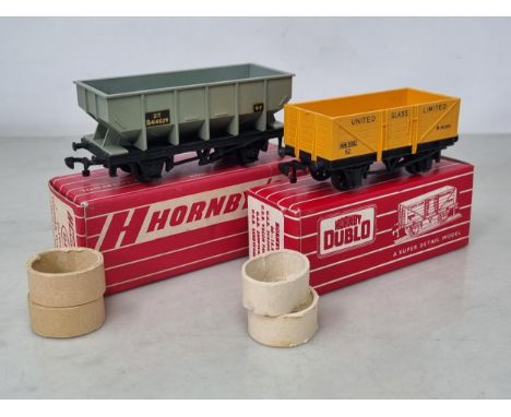 A boxed Hornby Dublo 4644 Hopper Wagon and a 4660 United Glass Ltd Wagon, both unused, M, both boxes perfect with correct typ