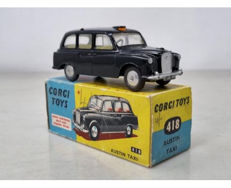 A boxed Corgi Toys No.418 Austin Taxi, Ex, box VG