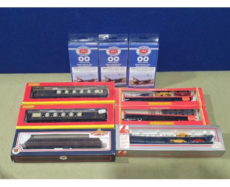 Two boxed Hornby 00 gauge Car Transporters, two boxed Hornby Pullman Coaches, a boxed Lima Car Transporter, a boxed Bachmann 