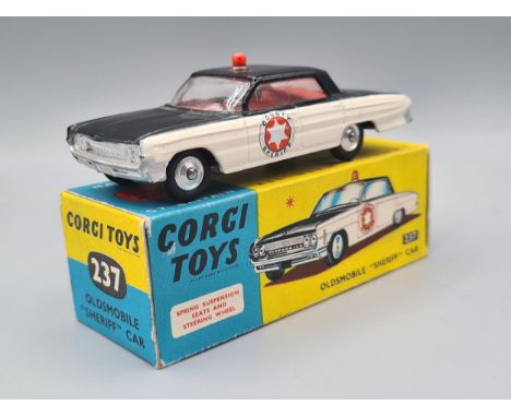 A boxed Corgi Toys No.237 Oldsmobile Sherriff Car, M, box Ex plus