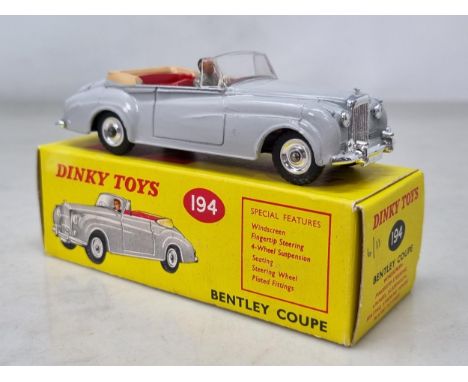 A boxed Dinky Toys No.194 Bentley Coupe with rare red interior, Nr M-M, box superb