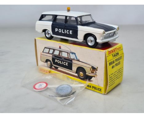 A boxed French Dinky Toys No.1429 Peugeot 404 Police with accessories, Nr M-M, box Ex with all packing