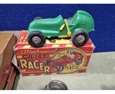 A boxed Marx mechanical Midget Racer, a tinplate clockwork Racing Car, a German tinplate friction driven Dolphin, various die