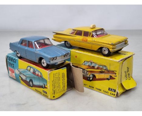 A boxed Corgi Toys No.252 blue Rover 2000 and a No.221 Chevrolet New York Taxi Cab, F, boxes P-F