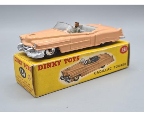 A rare boxed Dinky Toys No.131 pink Cadillac with spun hubs, M, box Ex plus