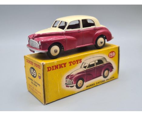 A boxed Dinky Toys No.159 maroon and cream Morris Oxford, Nr M-M, box Ex