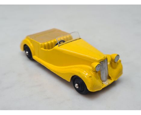 A Dinky Toys 38b yellow Sunbeam Talbot with fawn tonneau, Nr M-M