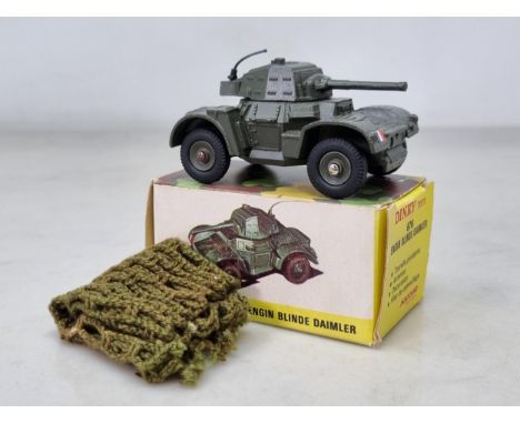 A boxed French Dinky Toys No.676 Daimler Armoured Car with camouflage, M, box Ex