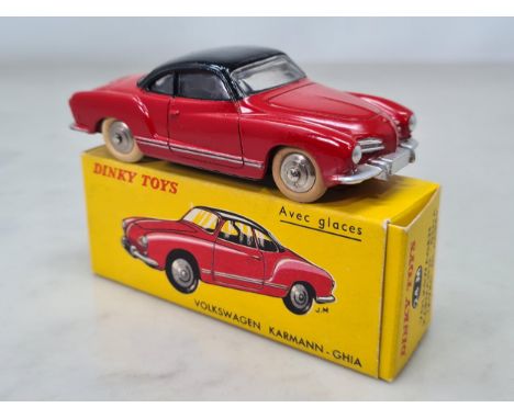 A boxed French Dinky Toys No.24M red and black Volkswagen Karmann Ghia, Nr M-M, box superb
