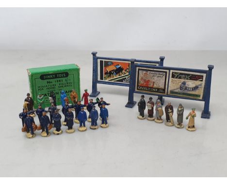 A set of Hornby Dublo pre-war Passengers and a Set of 1001 post-war Figures, together with two blue type Hoardings (possibly 