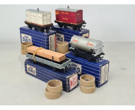 Four boxed Hornby Dublo 3-rail Wagons with 2-rail over stickers including Low-sided Furniture, Low-sided Meat, Double Bolster