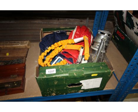 A box containing a quantity of sailing equipment to include hanging lantern, Musto and Hyde gloves etc. 