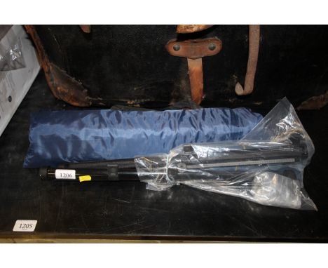 A small tent in bag and two roller car window blinds