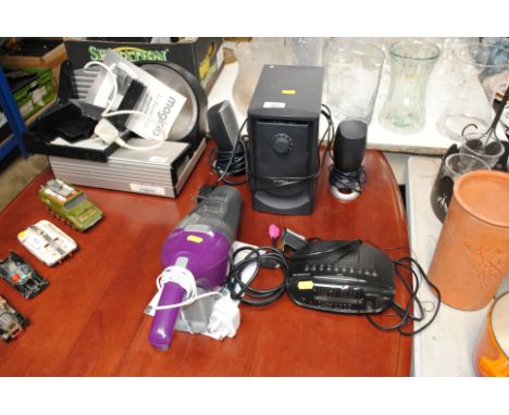 A Dell computer speaker system, a Roberts radio alarm clock and a Black & Decker Dustbuster