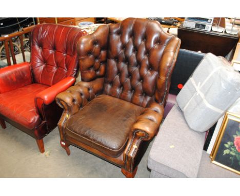 A button back upholsters wing armchair raised on cabriole supports AF