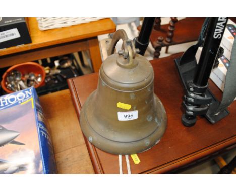 A brass bell with bracket