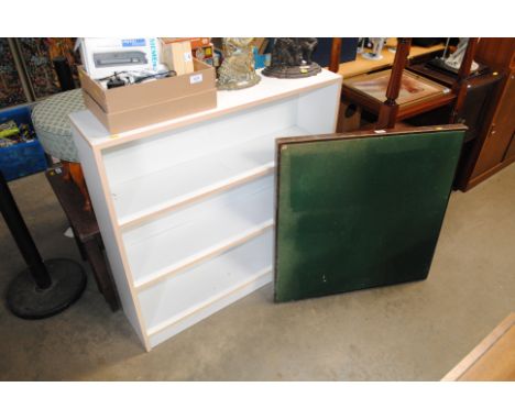 A bookcase, a folding card table