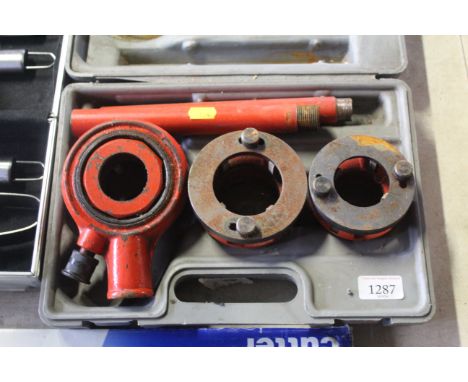A pipe threader in fitted plastic case