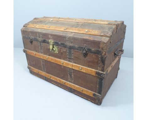 A Victorian dome top trunk, with tray fitted interior and various travel labels to the interior including Cunard. 85x59x50cm.