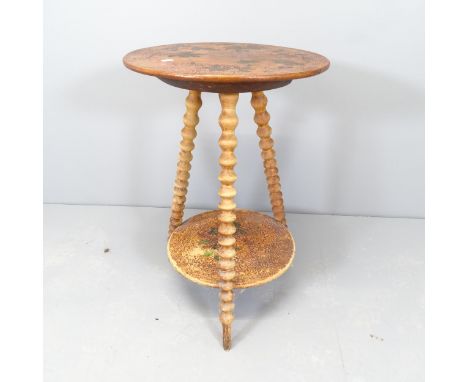 An antique mahogany two-tier circular occasional table, one bobbin turned legs. 44x67cm.Floral decoration very faded and dama