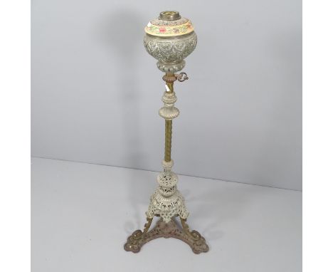 An antique wrought iron oil lamp stand, lacking burner and shade. Height 122cm. 