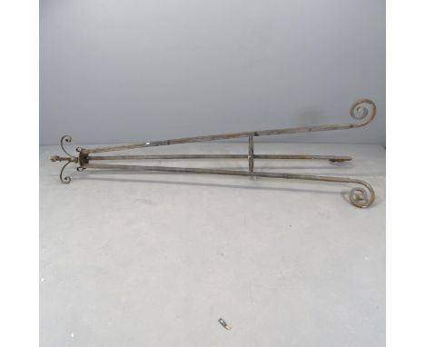 A wrought iron plant stand, the top having a bayonet light fitting (to be re-wired). Height 220cm. 