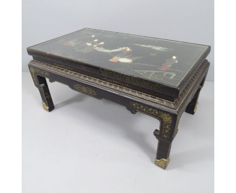 A Chinese black lacquered coffee table, with hardstone, ivory and gilt-painted decoration and inset glass top. 91x45x54cm.&nb