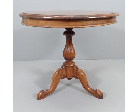 An antique mahogany circular occasional table on tripod base. 70x65cm 