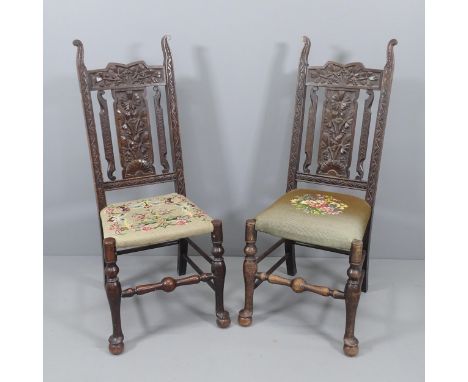 A pair of 19th century carved oak and tapestry upholstered hall chairs. 