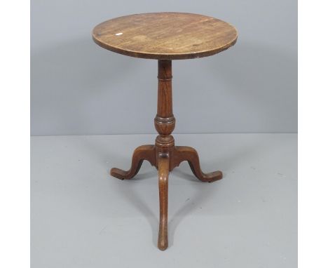 An antique oak circular topped occasional table on tripod base. 48x72cm. 