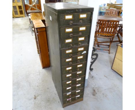 A vintage painted metal bank of eleven filing drawers. 34x132x66cm 