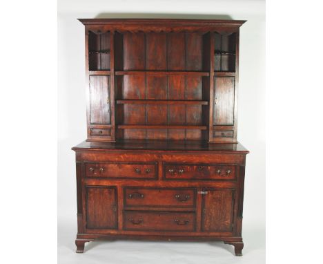 LATE GEORGIAN OAK AND MAHOGANY CROSSBANDED DRESSER, the plate rack with moulded cornice above a pierced frieze and three shel