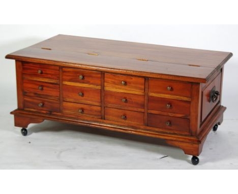 MODERN MANGO WOOD 'ANCIENT MARINER' STORAGE CHEST, the moulded and part hinged top above a pair of heavy cast metal side hand