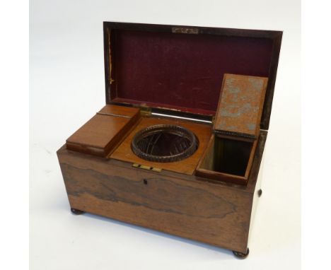 EARLY NINETEENTH CENTURY ROSEWOOD TEA CADDY, OF SARCOPHAGUS FORM with bun feet, the interior with a pair of removable holders