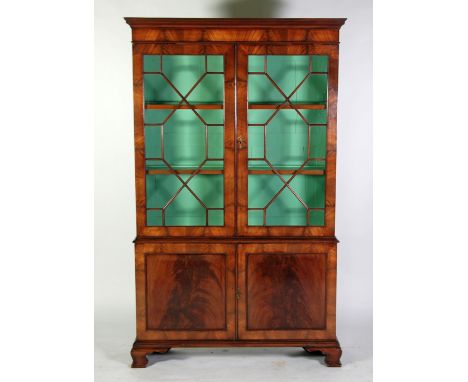 GEORGIAN STYLE FLAME CUT MAHOGANY LIBRARY BOOKCASE/DISPLAY CABINET, of narrow proportions, the moulded cornice above a pair o