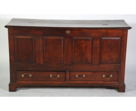 EIGHTEENTH CENTURY OAK DOWER CHEST, the two plank top with moulded edge, above a four panelled front with two cockbeaded draw