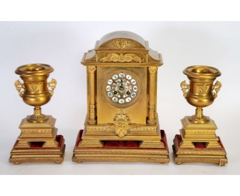 LATE 19TH CENTURY FRENCH ORMOLU GARNITURE-DE-CHEMINEE, the clock with pierced floral centre to the 3 3/4" Roman dial, powered