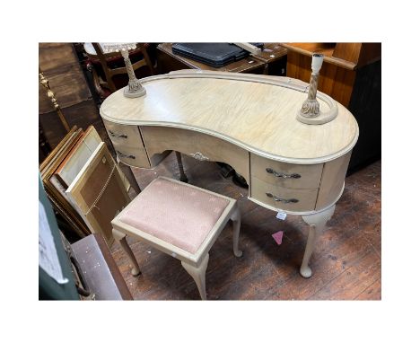 Dressing table kidney shaped in cream with free standing twin lamp holders and stool.