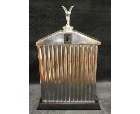 A cast metal Rolls Royce model of a radiator grille with Spirit of Ecstasy finial, angled wood stand, 51cm high