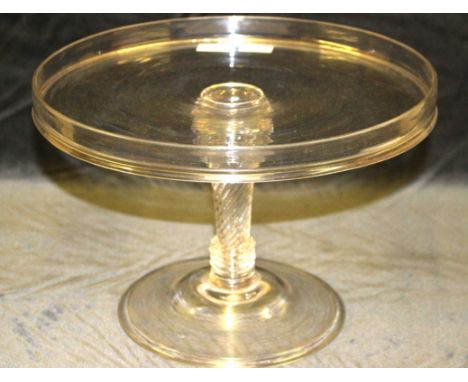 A George III glass tazza with raised rim and spirally and ring turned column on domed folded foot, 20cm high x 28.5cm diam